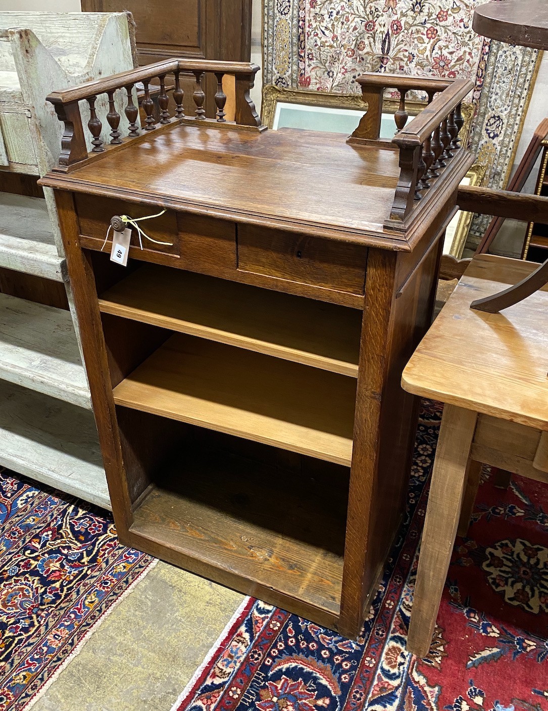 An early 20th century French oak clerk's desk, width 70cm, depth 50cm, height 112cm